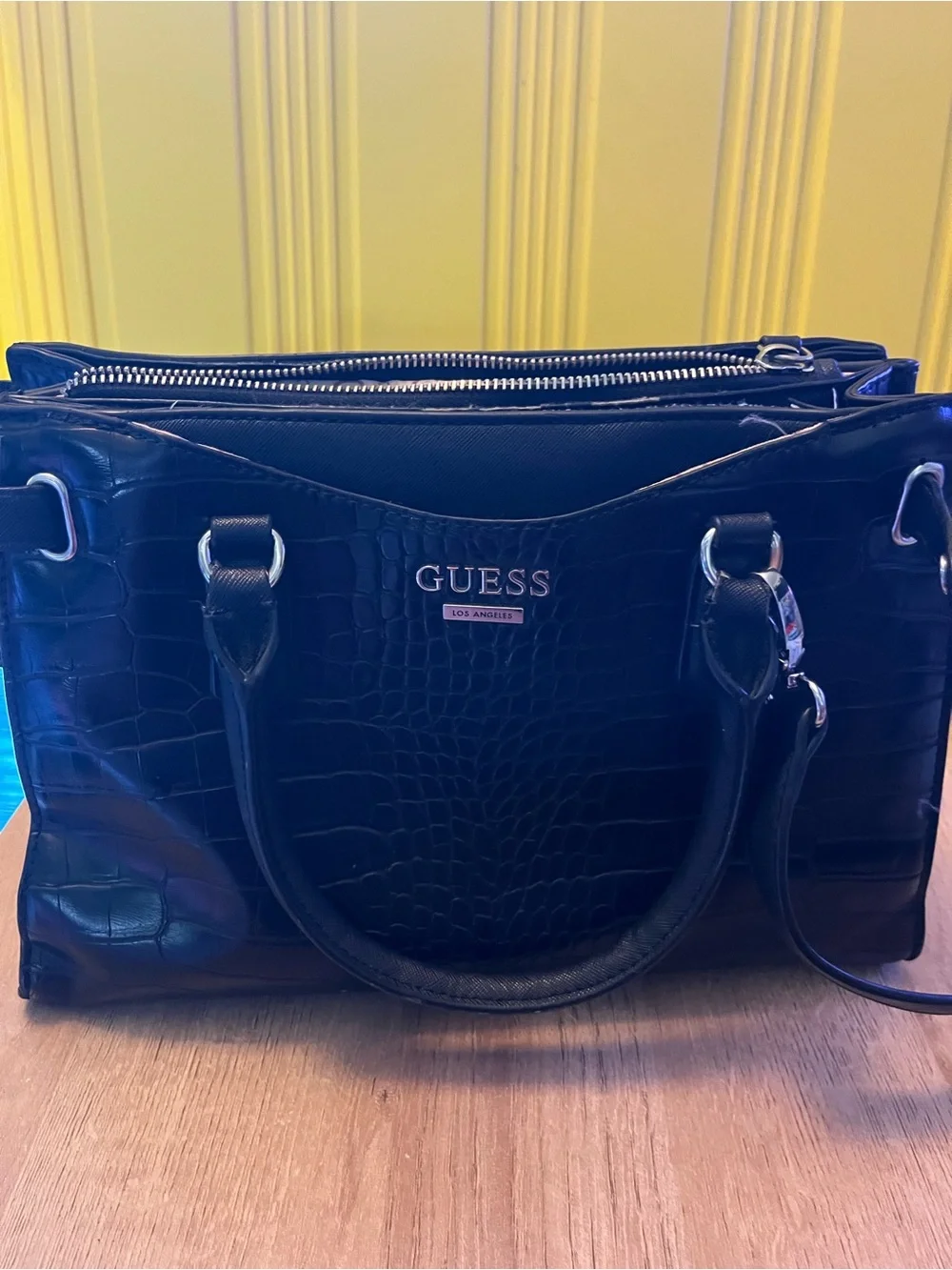 Guess Black Embossed Satchel Bag in good condition except missing one button